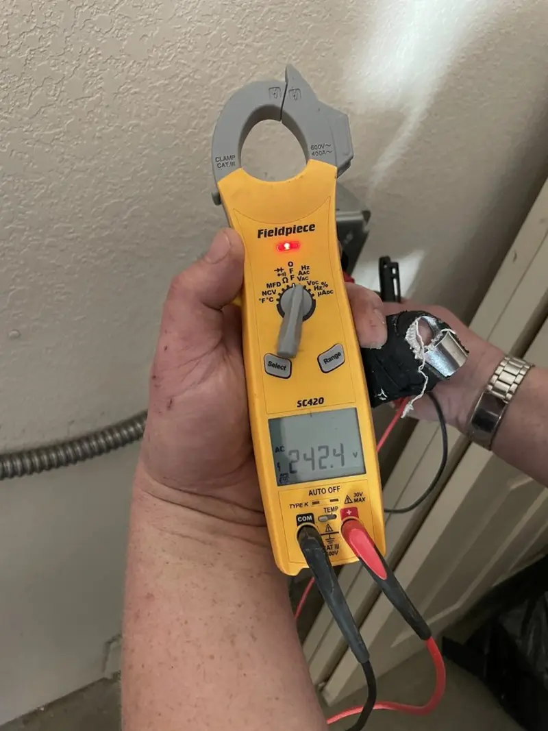 Voltage testing with clamp meter during Hot Tub / Pool Electrical Wiring in Buxton